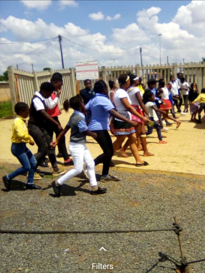 Young people taking part in an outdoor group activity